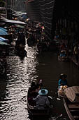 Thailand, Locals sell fruits, food and products at Damnoen Saduak floating market near Bangkok 